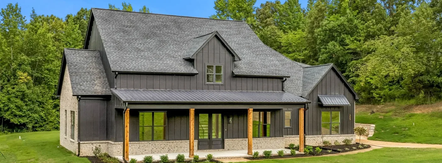 A finished home seen wide, showing the addition
