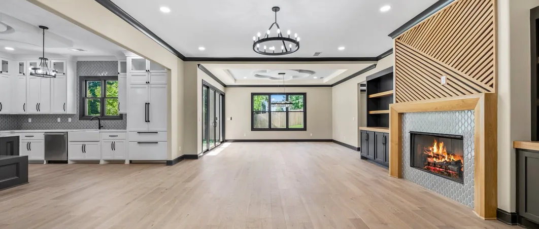A finished living room with a fireplace